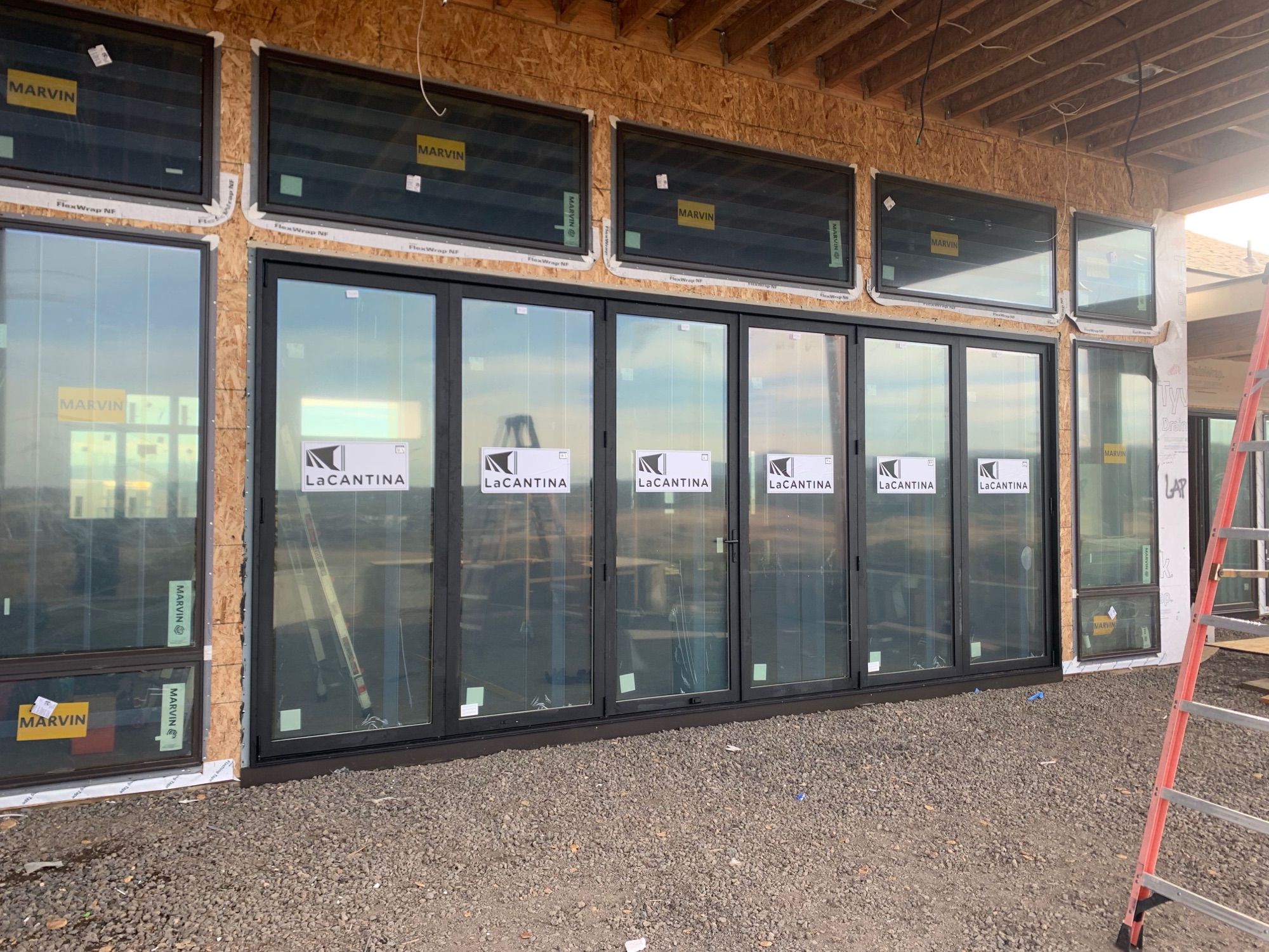 Accordion glass door system opening a room to the outdoors
