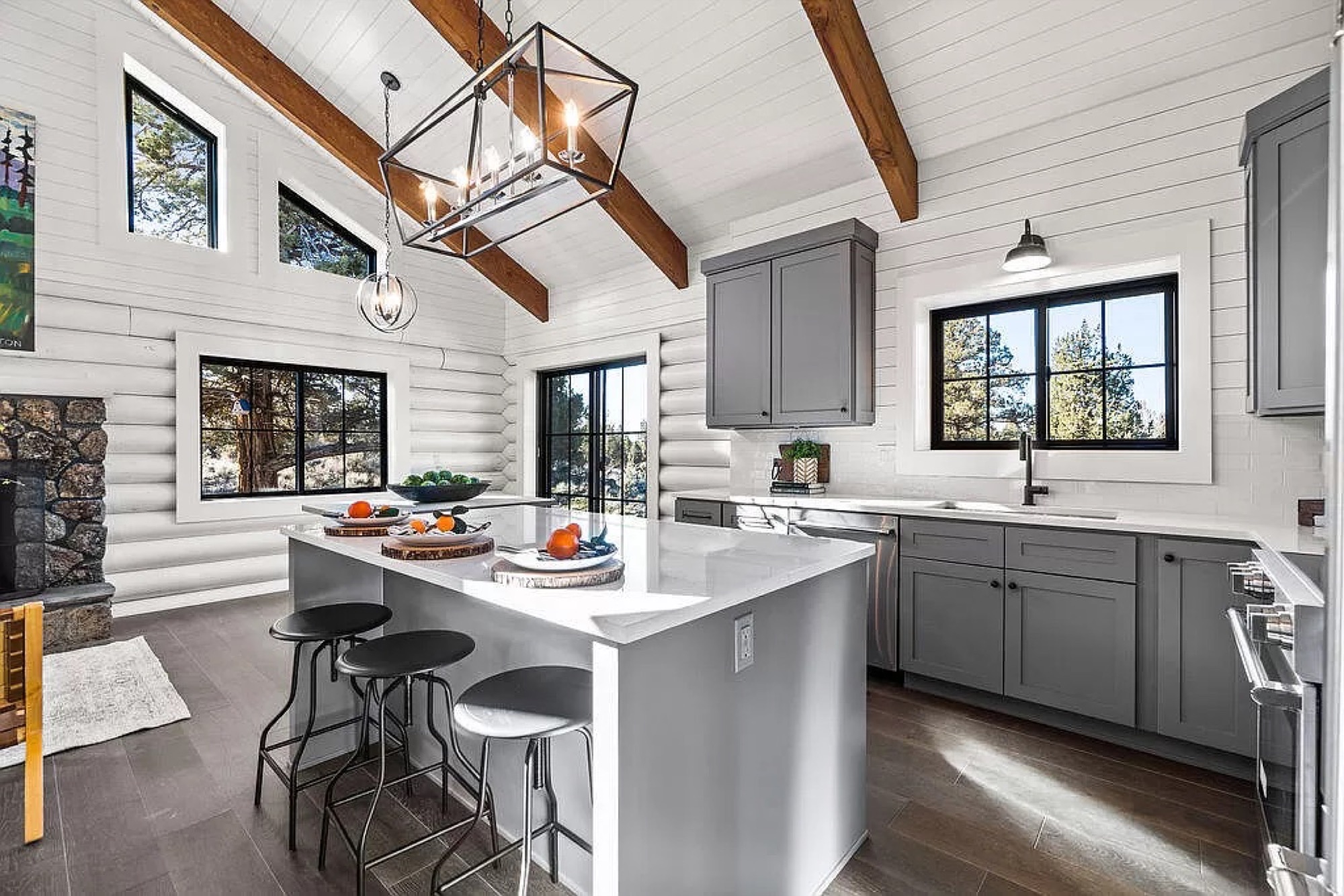 Shiplap kitchen with wood ceiling and black window frames